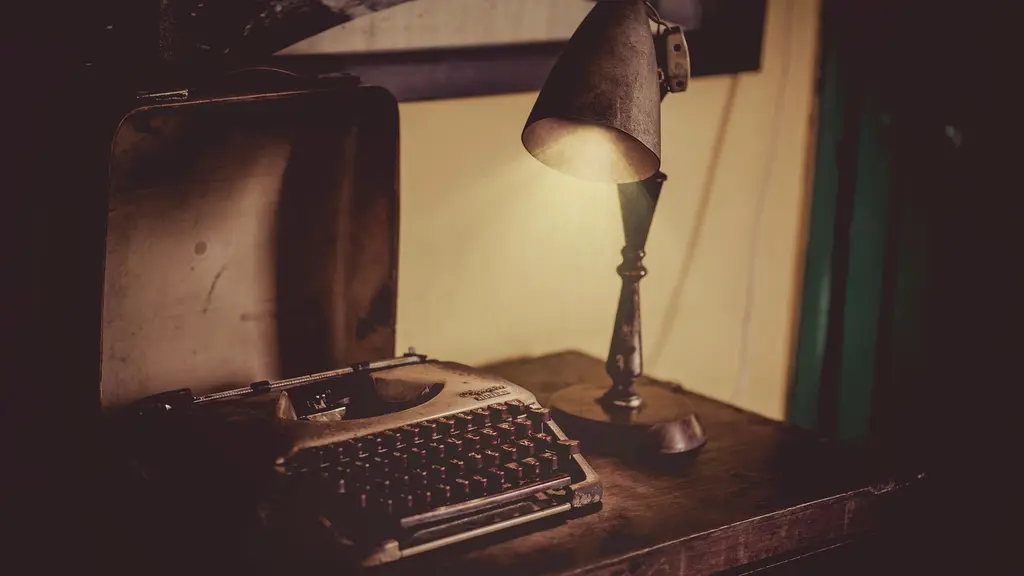 a pen resting on an open notebook beside a window at first light