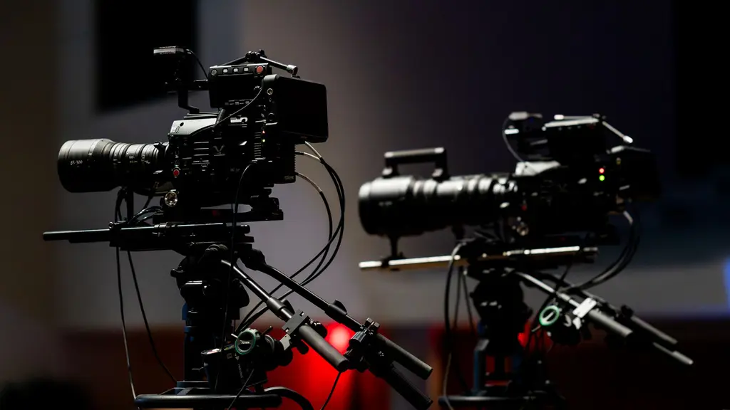 a cinema camera on a tripod in a doorway