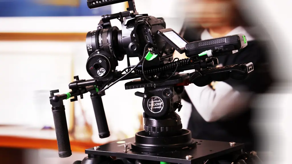 a cinema camera on a tripod in a doorway